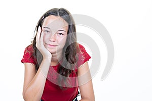 Young beautiful girl with curly hair hand on chin relaxed serious expression on face Simple natural looking at camera