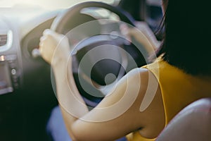 Young beautiful girl driving a car. Selective Focus