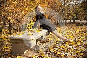 Young beautiful girl enjoying warm autumn sun