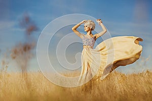 Young beautiful girl at field