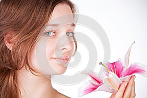 Young beautiful girl with a flower