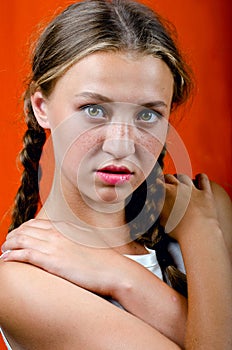 Young beautiful girl in freckles