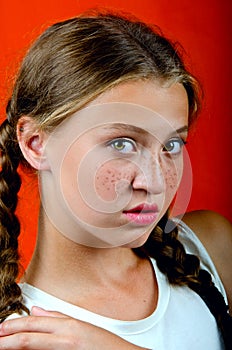 Young beautiful girl in freckles