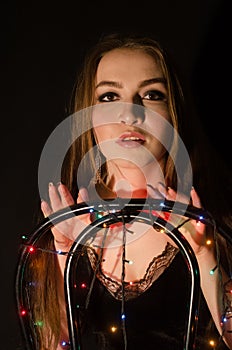 Young beautiful girl with garland