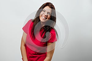 A young, beautiful girl is happy. Isolated on white background. Positive human emotions, a sense of facial expression, attitude,