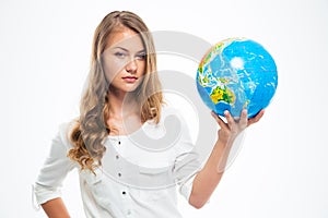 Young beautiful girl holding globe