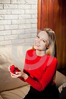 Young beautiful girl holding her engagement ring in excitement