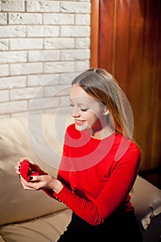 Young beautiful girl holding her engagement ring in excitement