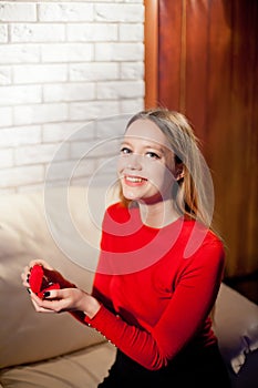 Young beautiful girl holding her engagement ring in excitement