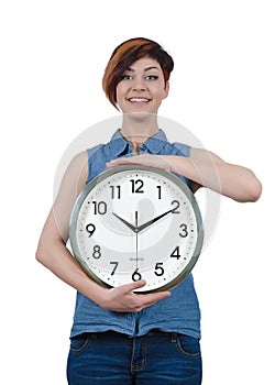 Young beautiful girl holding a large wall clock