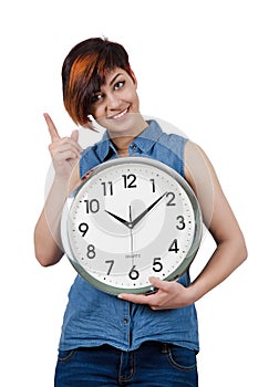 Young beautiful girl holding a large wall clock.