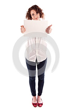 Young beautiful girl holds a empty white sign for you to fill in