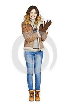 Young beautiful girl in a leather sheepskin coat and blue jeans