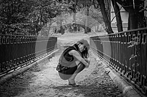 A young beautiful girl with long hair walks through the spring Stryjsky park in Lviv