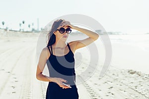 Young beautiful girl looks afar at sea