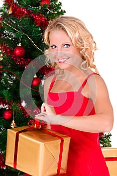 Young beautiful girl opening Christmas box