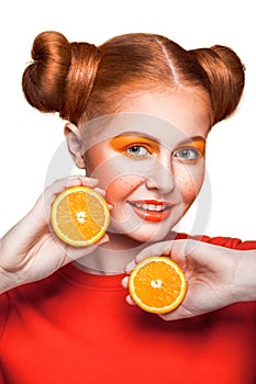 Young beautiful girl with orange.