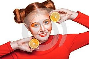 Young beautiful girl with orange.