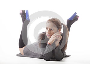 Young beautiful girl with pigtails on white background