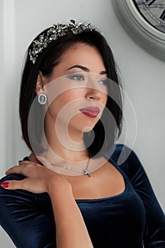 Young beautiful girl posing in the interior studio