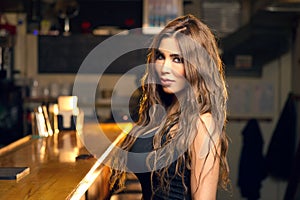 Young Beautiful Girl Posing in a Pub