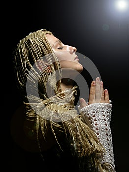 Young and beautiful girl praying 2