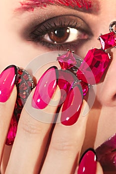 Young beautiful girl with red rose make-up and manicure