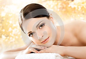 Young and beautiful girl relaxing in a spa salon