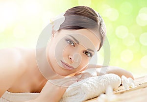 Young and beautiful girl relaxing in a spa salon