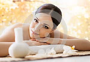 Young and beautiful girl relaxing in a spa salon