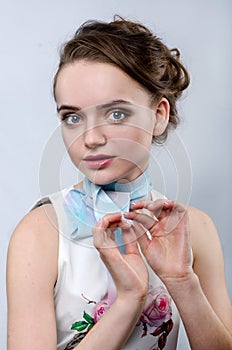 Young beautiful girl with a ribbon