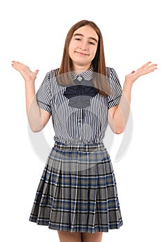 Young beautiful girl in a school uniform on a white background