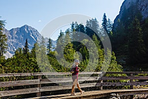 Young beautiful girl traveler , mountains Alps background,