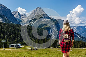 Young beautiful girl traveler , mountains Alps background,