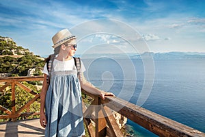 Young beautiful girl traveling along the coast of the Mediterranean Sea