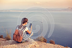 Young beautiful girl traveling along the coast of the Mediterranean Sea