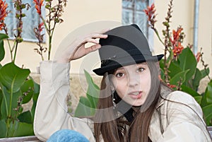 Young beautiful girl in a trilby hat