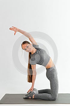 Young beautiful girl wearing fashion sports wear doing exercise