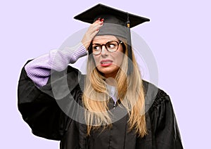 Young beautiful graduate woman student