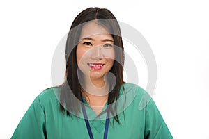 Young beautiful and happy Asian Chinese medicine doctor woman or hospital nurse in green scrubs posing cheerful smiling confident