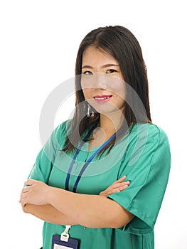 Young beautiful and happy Asian Chinese medicine doctor woman or hospital nurse in green scrubs posing cheerful smiling confident