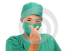 Young beautiful and happy Asian Chinese medicine doctor woman or hospital nurse in medical hat face mask and scrub doing fingers