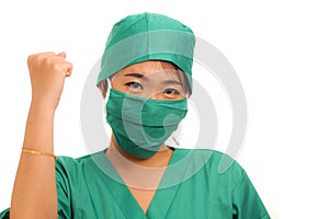 Young beautiful and happy Asian Chinese medicine doctor woman or hospital nurse in medical hat smiling cheerful behind surgeon