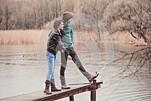 Young beautiful happy loving couple on the walk in early spring