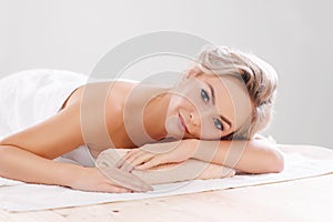 Young, beautiful and healthy girl relaxing in spa salon. Rejuvenation therapy and massaging treatments. Recreation