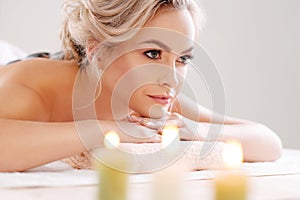 Young, beautiful and healthy girl relaxing in spa salon. Rejuvenation therapy and massaging treatments. Recreation