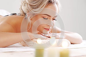Young, beautiful and healthy woman relaxing in spa salon. Rejuvenation therapy and massaging treatments. Recreation