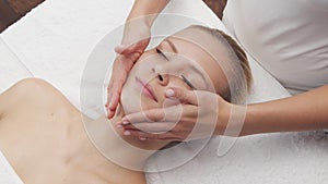 Young, beautiful and healthy woman in spa salon. Traditional Thai massage therapy and skin care.