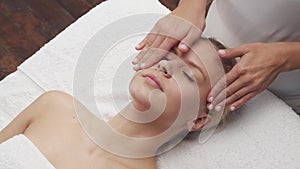 Young, beautiful and healthy woman in spa salon. Traditional Thai massage therapy and skin care.