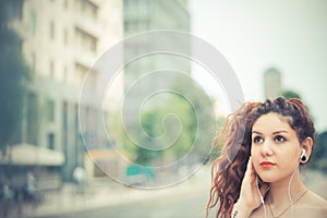 Young beautiful hipster woman with red curly hair